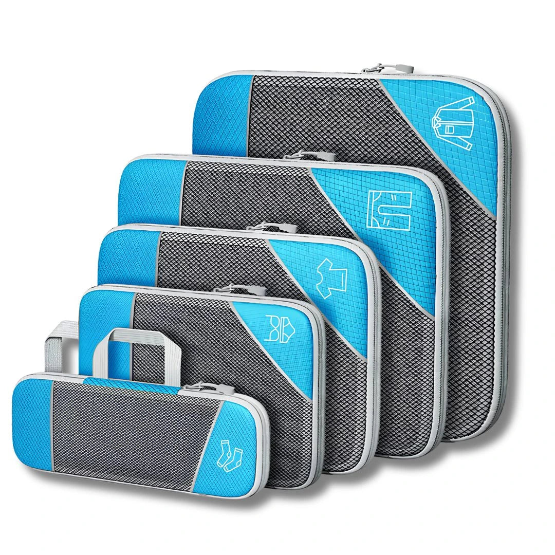 Space-saving travel organisers and compression cubes packed inside holiday luggage