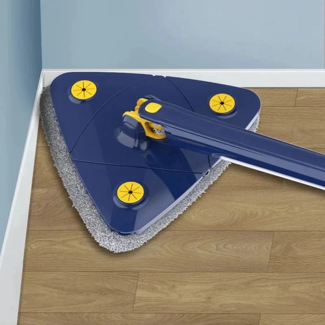 Cleaning tool with a blue handle and gray scrubber head on a wooden floor.