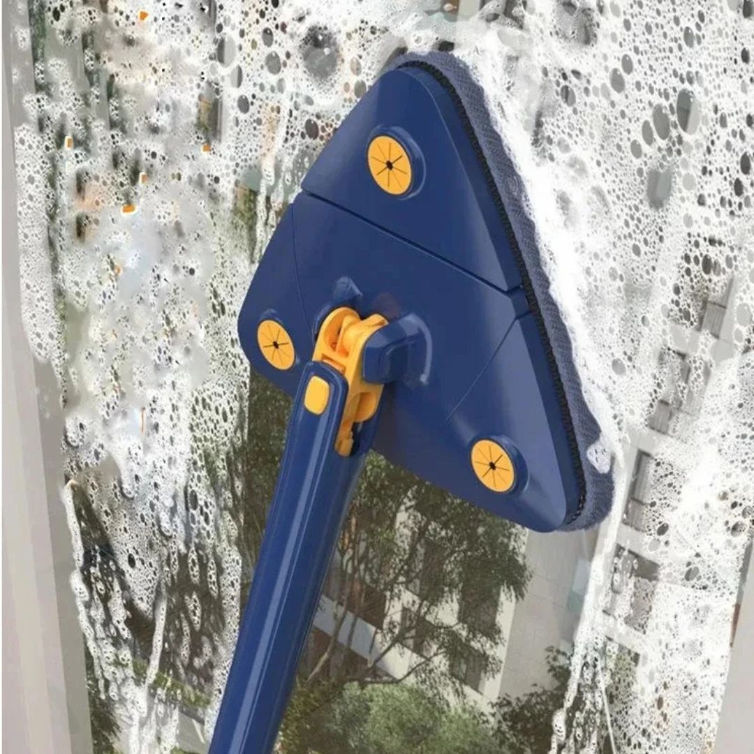 Window cleaning tool with blue and yellow handle cleaning a window