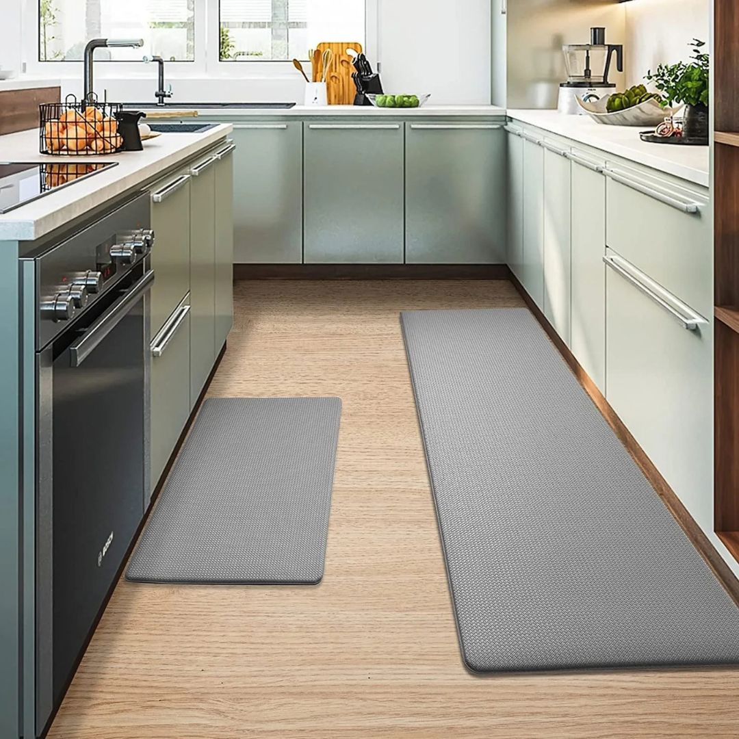 Anti fatigue kitchen mat with bevelled edge preventing tripping on tile floor