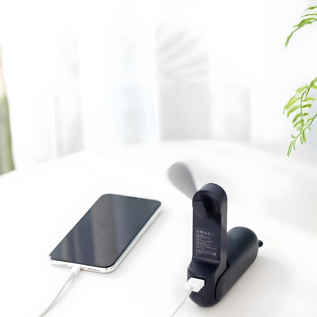 Foldable Pocket Travel Fan cooling down while sightseeing abroad