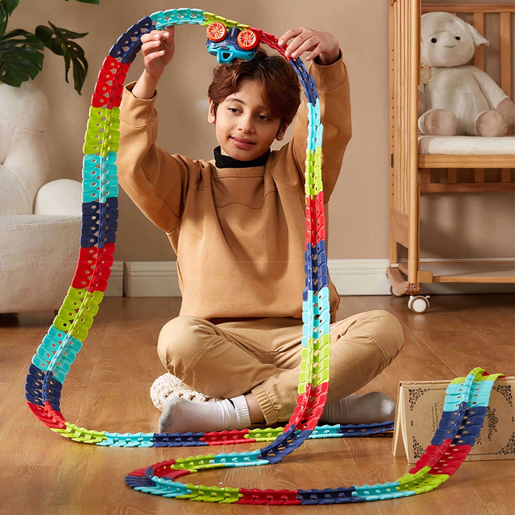 Child playing with bendable race track and snap-together pieces