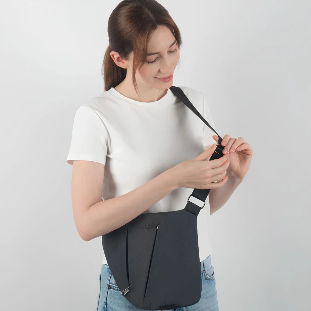 Secure anti-theft sling bag with hidden compartments for travel valuables