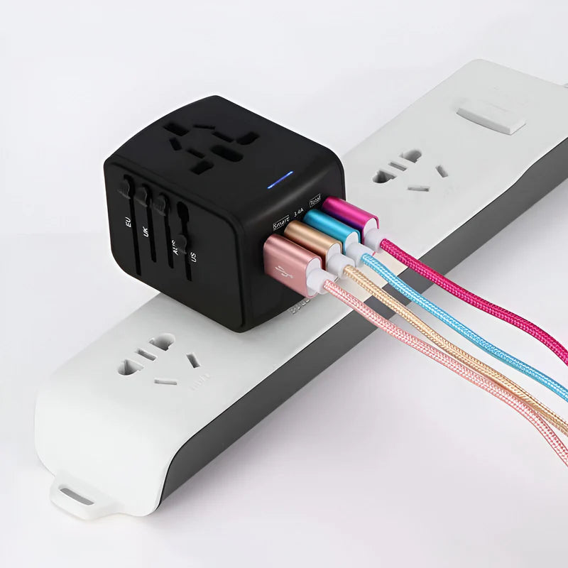 Compact worldwide travel adapter charging multiple devices at once — phone, laptop, camera on international trip