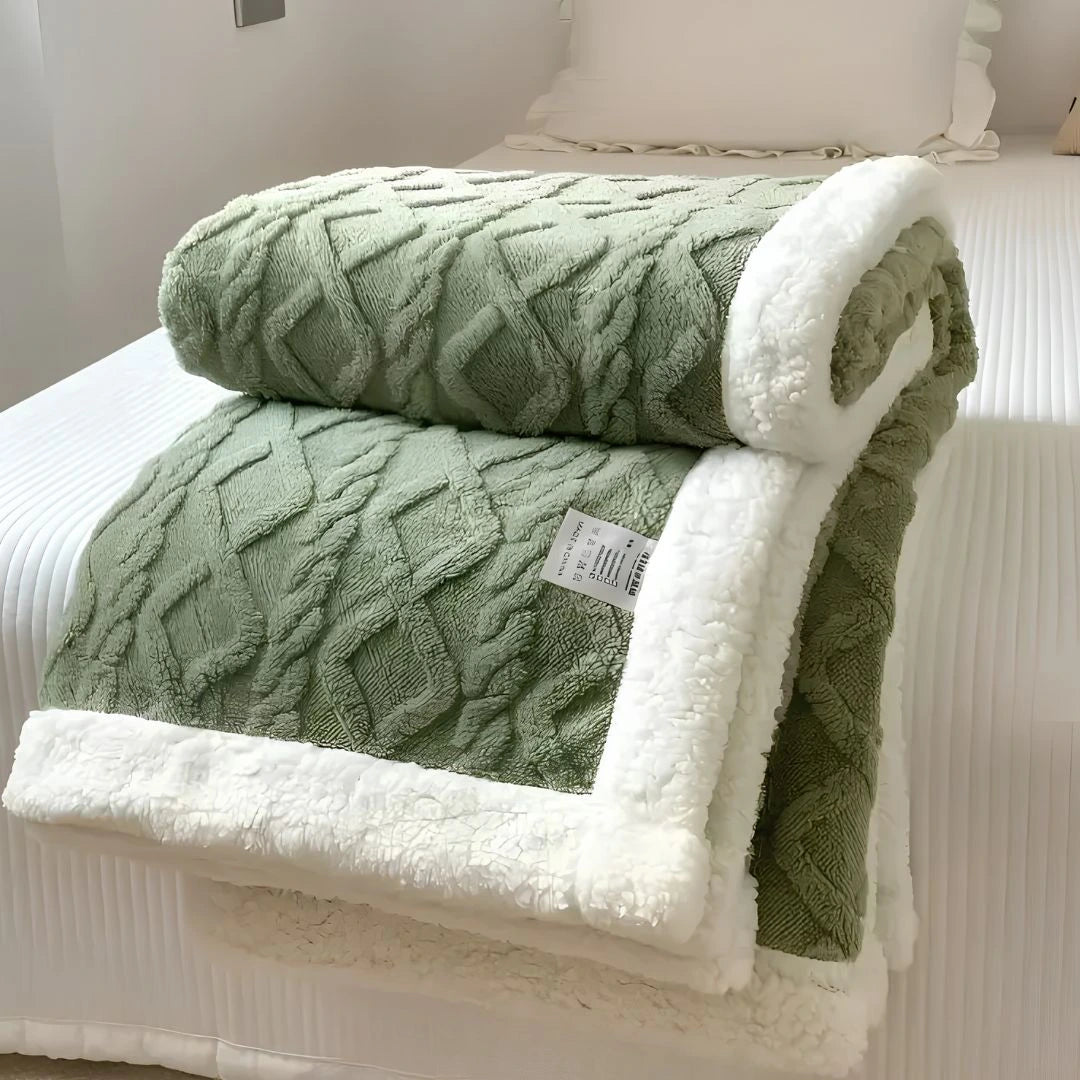 CozyCloud double-sided fleece throw blanket draped over couch in cosy living room