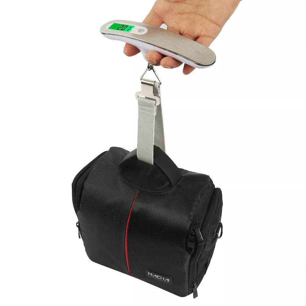 Digital luggage scale weighing suitcase before airport check-in
