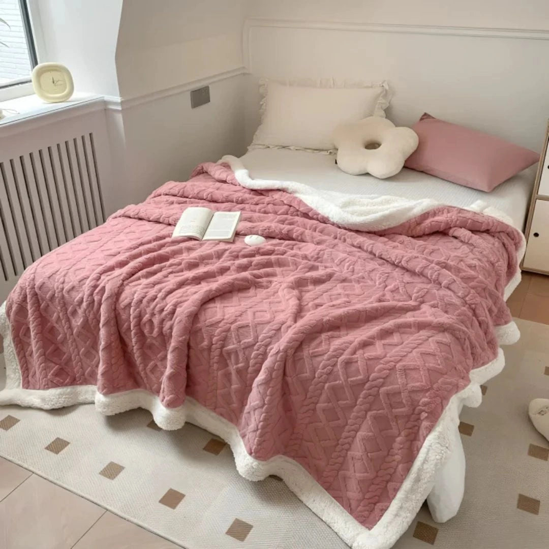 Double-sided fleece blanket layered on bed for extra warmth during winter nights