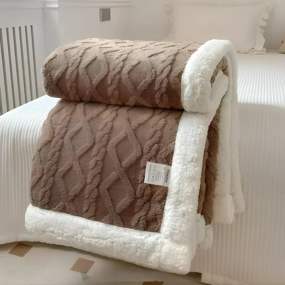 Lightweight fleece throw draped over armchair in modern living room decor