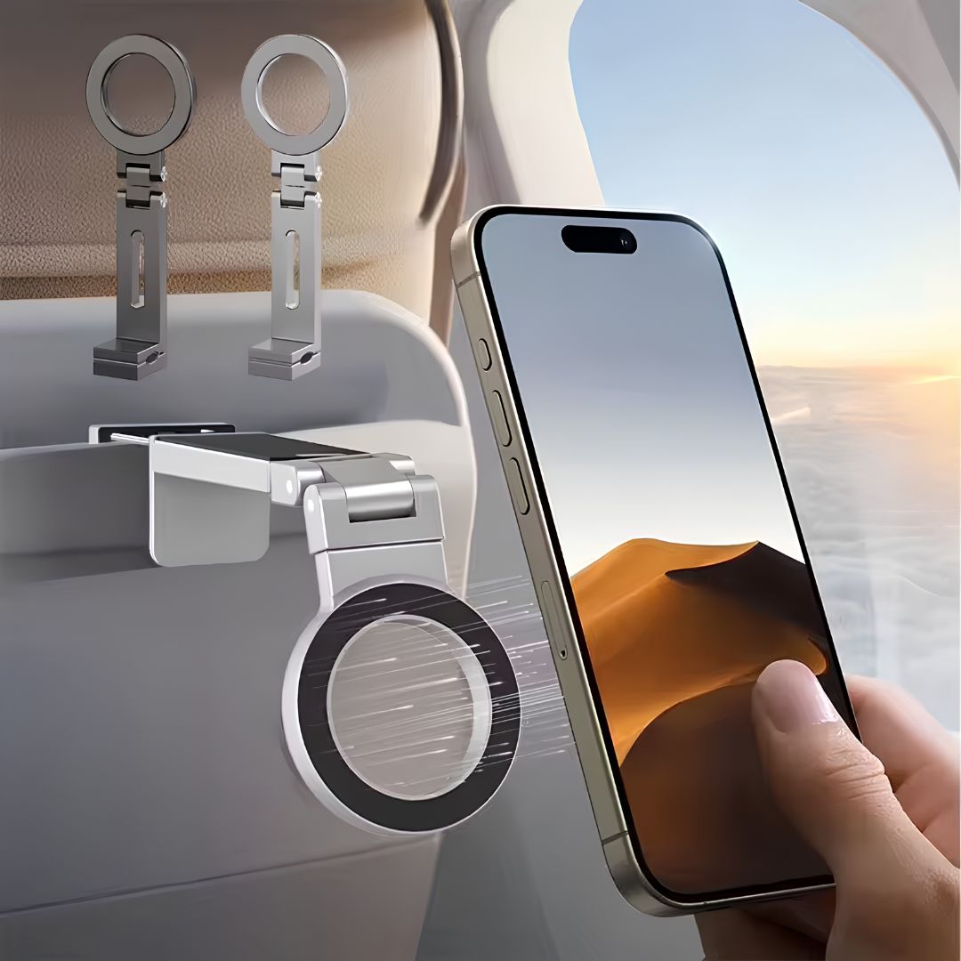 Magnetic travel phone holder clipped to airplane tray table