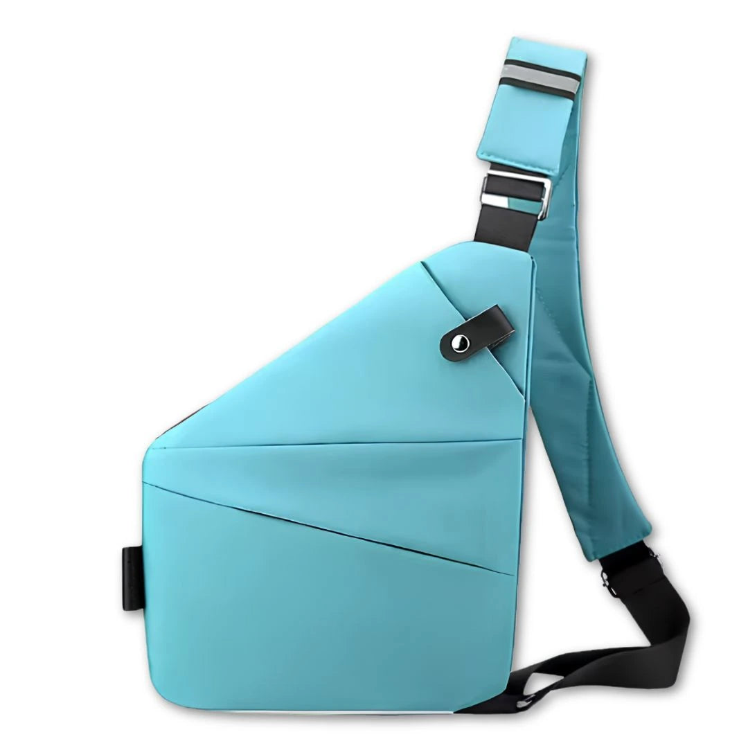A light blue Slim profile crossbody bag that fits under a jacket for extra pickpocket protection