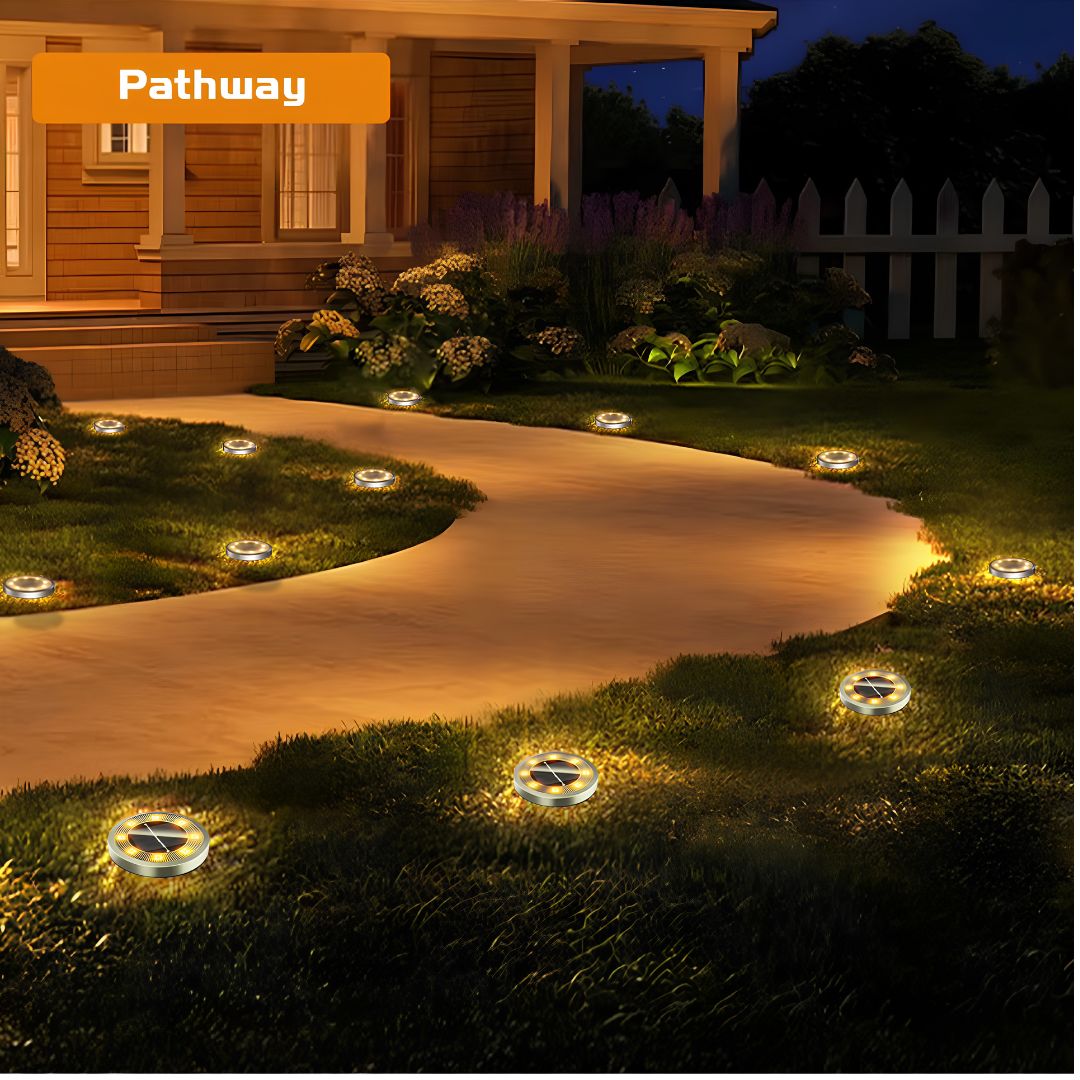 Solar disc lights with 360 degree illumination glowing warm on walkway