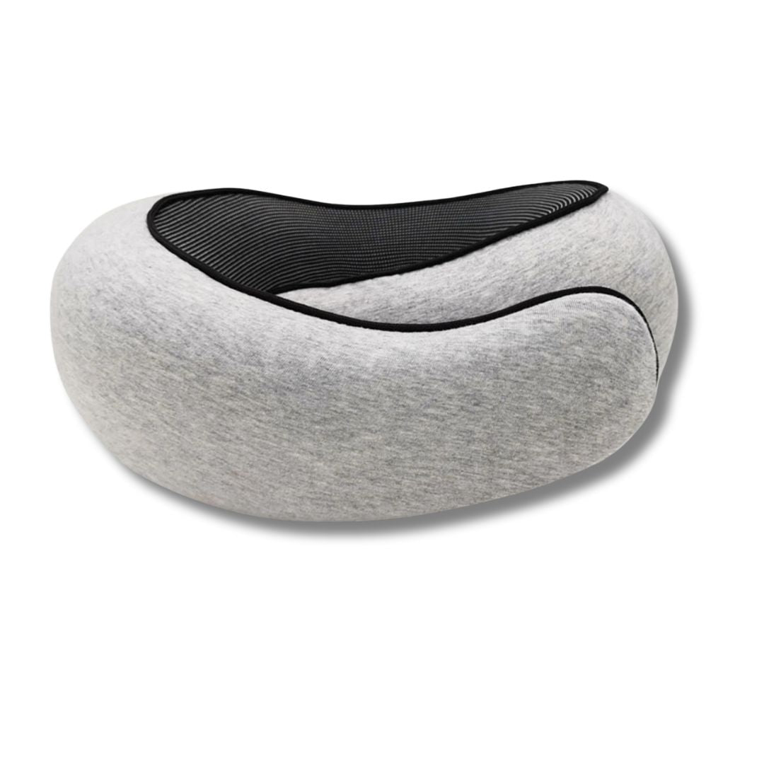 Traveller using memory foam pillow on airplane seat